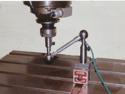 Illustration of the Contisure Ball Bar, being used for measurement and assessment of circular contouring on a machine tool.